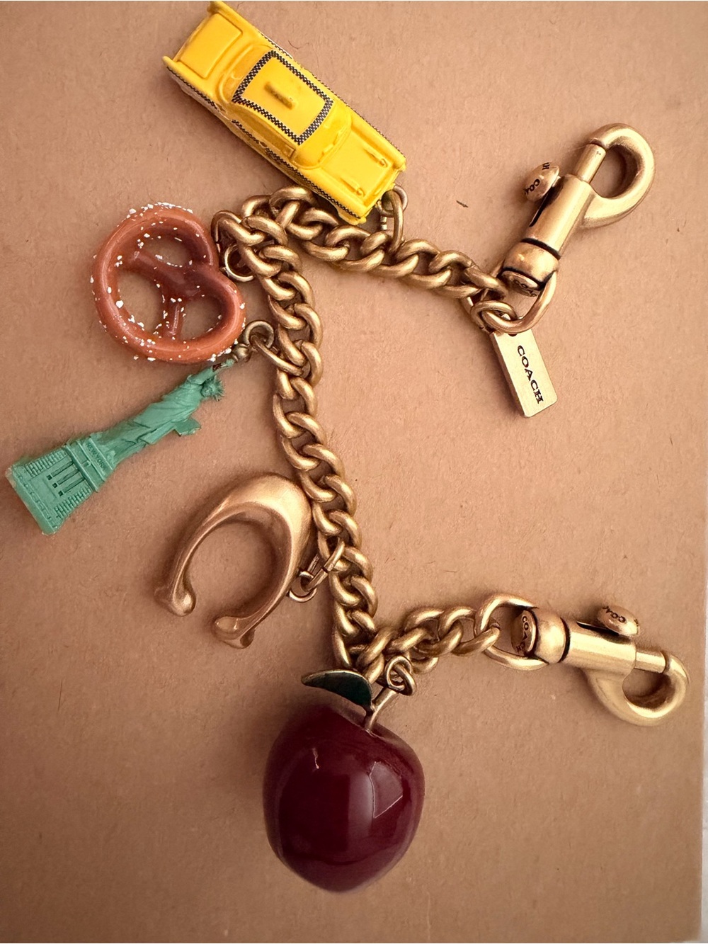 Coach Gold Charm Strap with NYC Charms